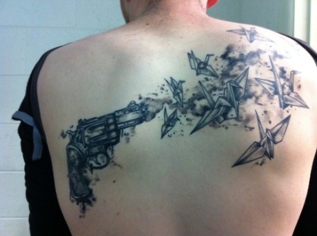 gun and origami crane tattoo